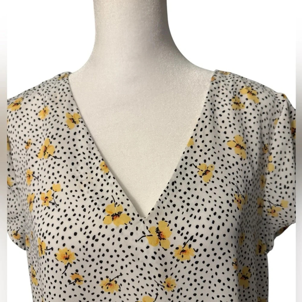 Lily White v neck top with black design with yellow flowers. Hi-Lo Size Medium - Picture 2 of 8